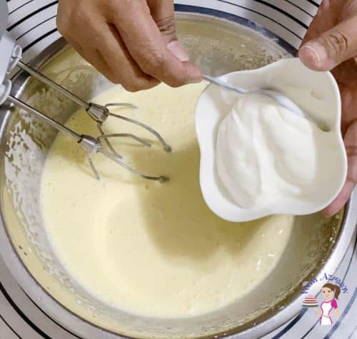 Add the sour cream to the raspberry cake batter
