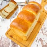 Softest sandwich bread on a wooden board.