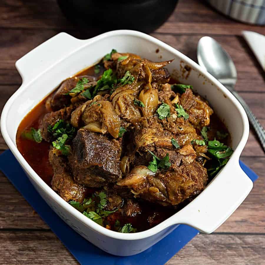 A casserole dish with lamb curry.