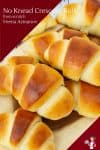 No Knead homemade soft bread rolls into crescent shape