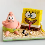 Spongebob and Patrick cakes on a wooden board.
