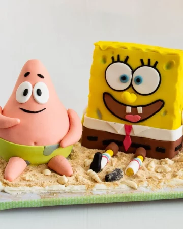 Spongebob and Patrick cakes on a wooden board.