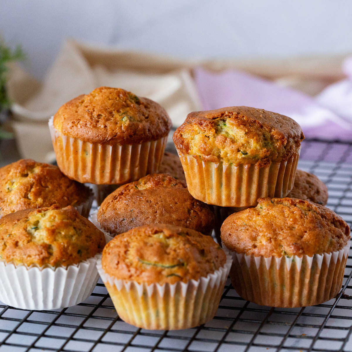 A stack of muffins on the wire rack.
