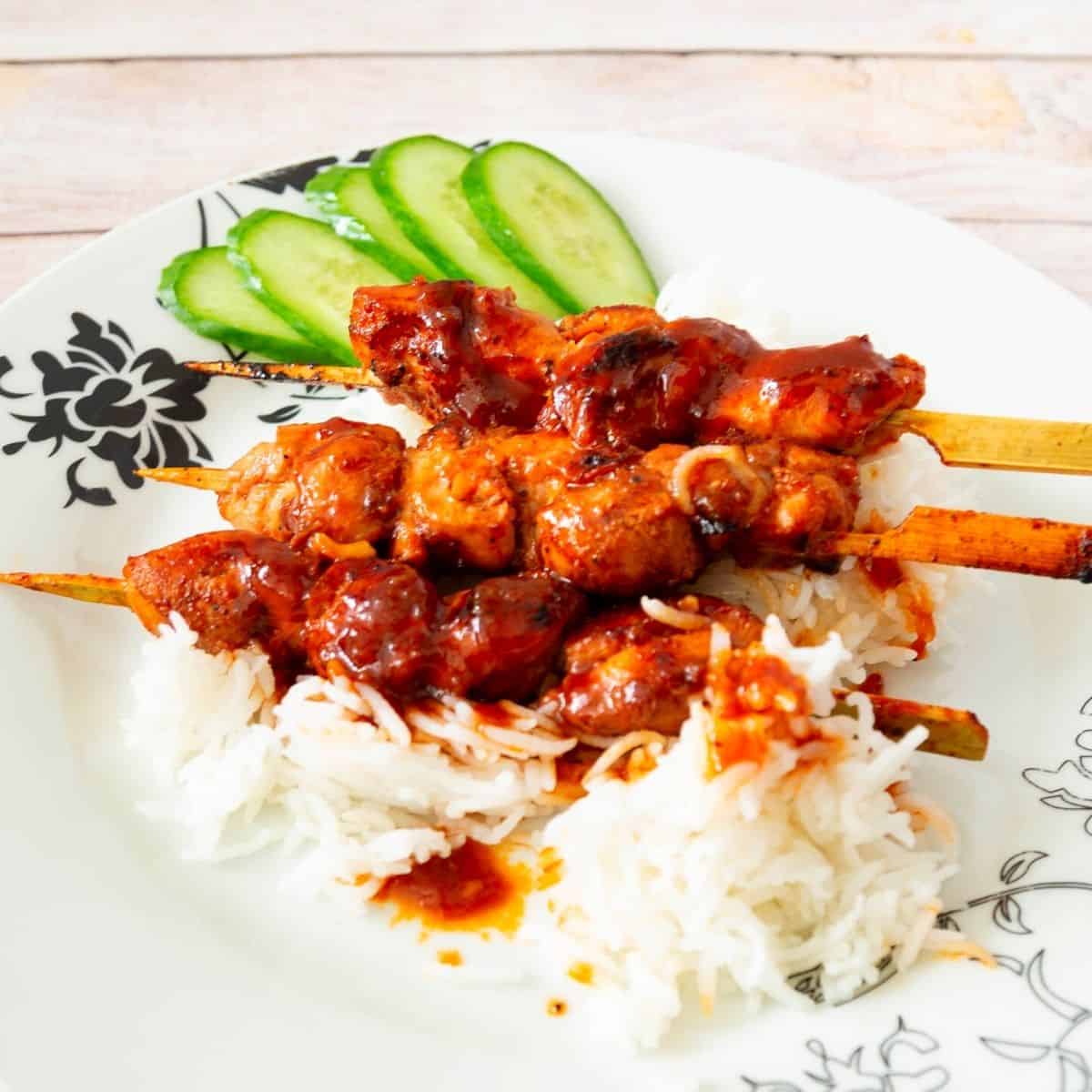 Asian skewers on steamed rice.