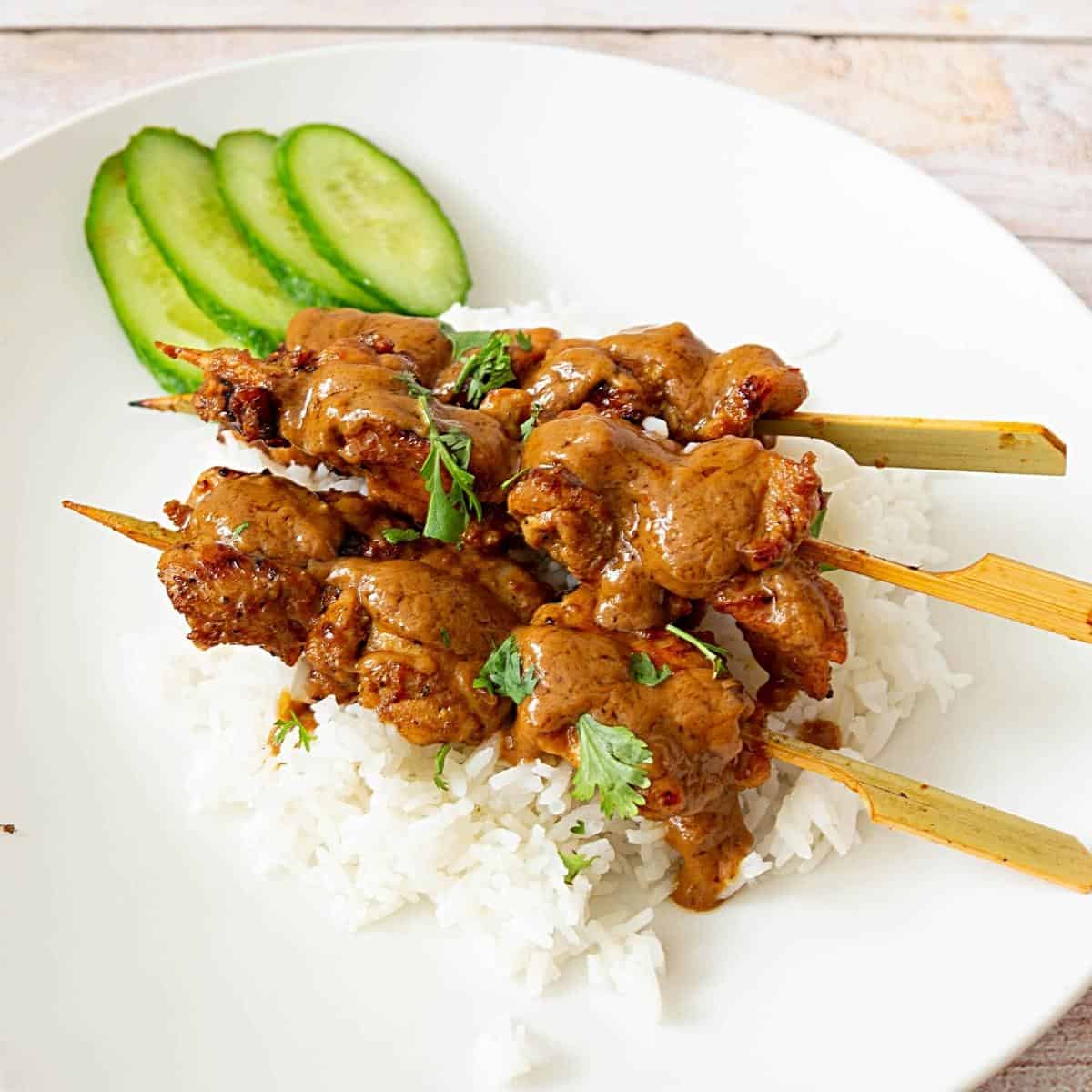 Satay skewers served with white rice.