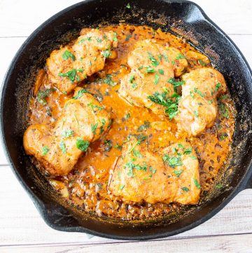 A skillet with creamy Chicken