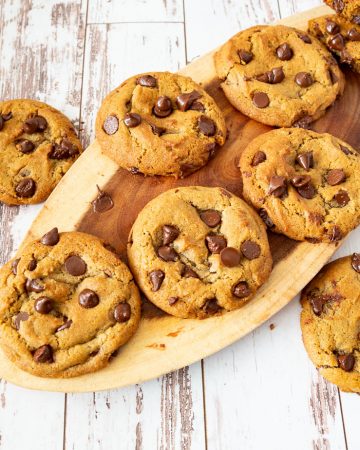 chocolate chip cookies on a wooden serving plate