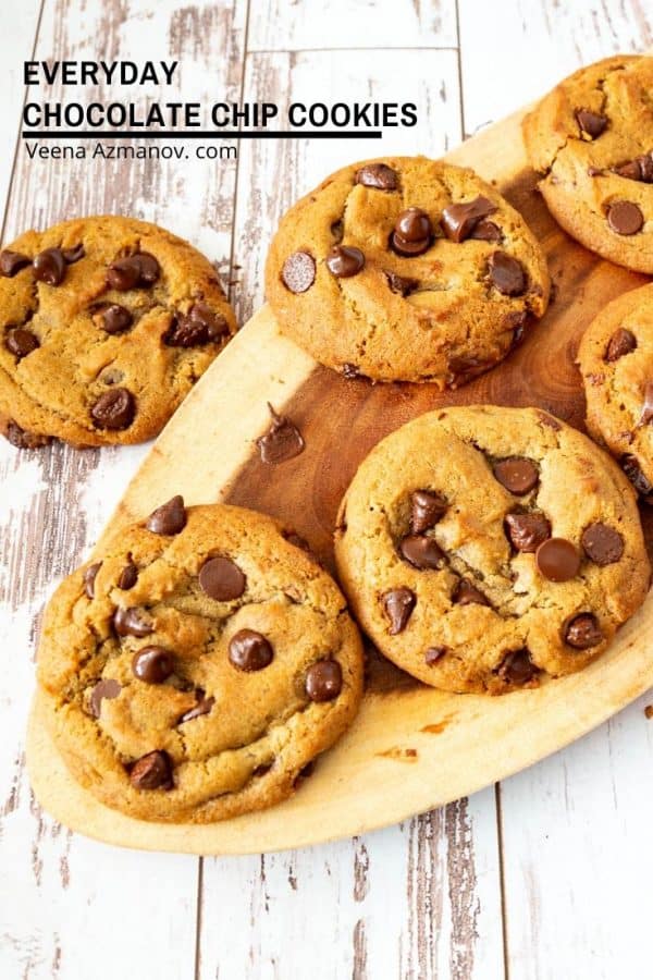 Chocolate chip cookies on a wooden tray.