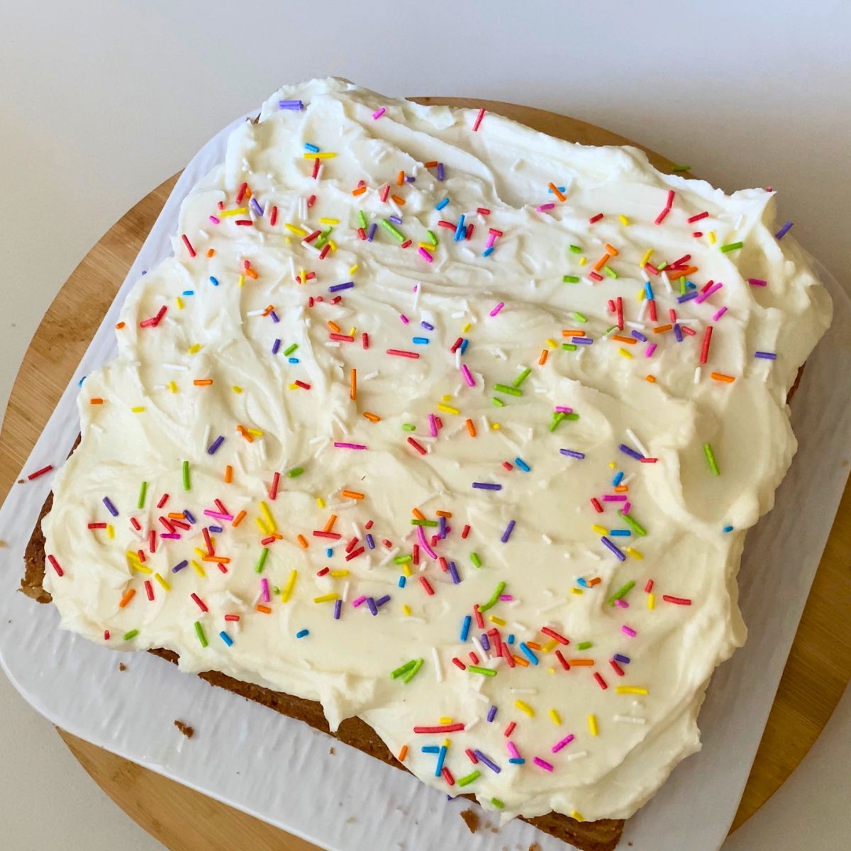 Funfetti cake batter in a square pan with funfetti.