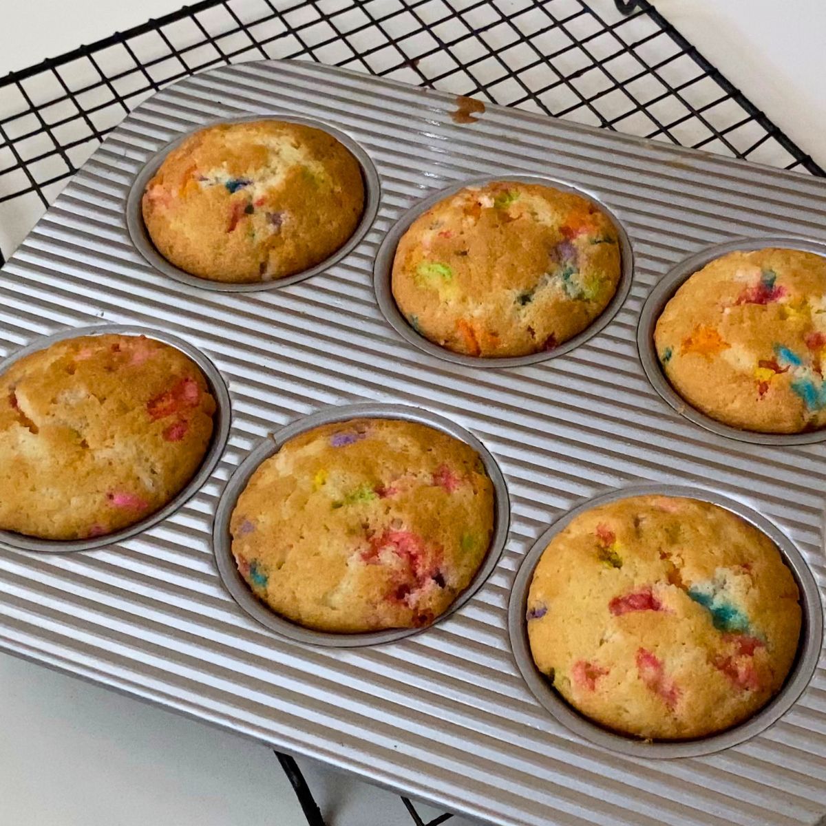 A baking pan with funfetti cupcakes.