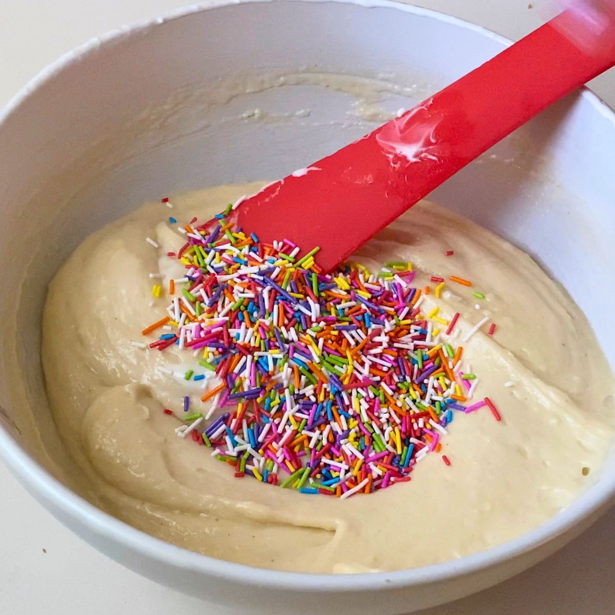 Add funfetti to the cupcake batter.