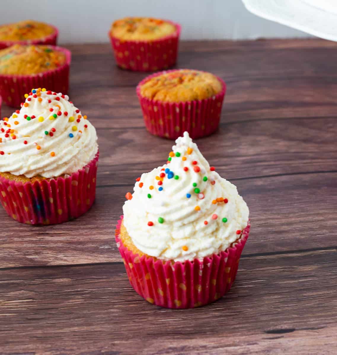 Funfetti cupcakes on a table.