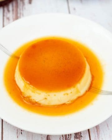 An inverted flan on a side plate.
