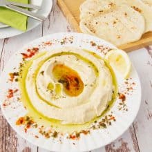 Hummus in a plate with olive oil.