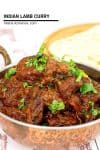 A close up of lamb curry in a metal dish.