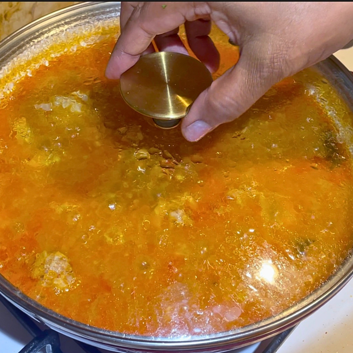 Simmer the chicken until the lentils are soft.