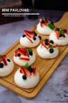 Mini Pavlovas on a wooden board.