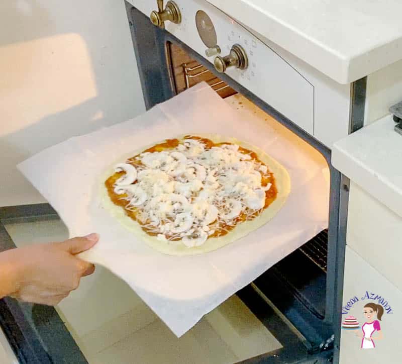 Put the pizza on the pizza peel and into the oven