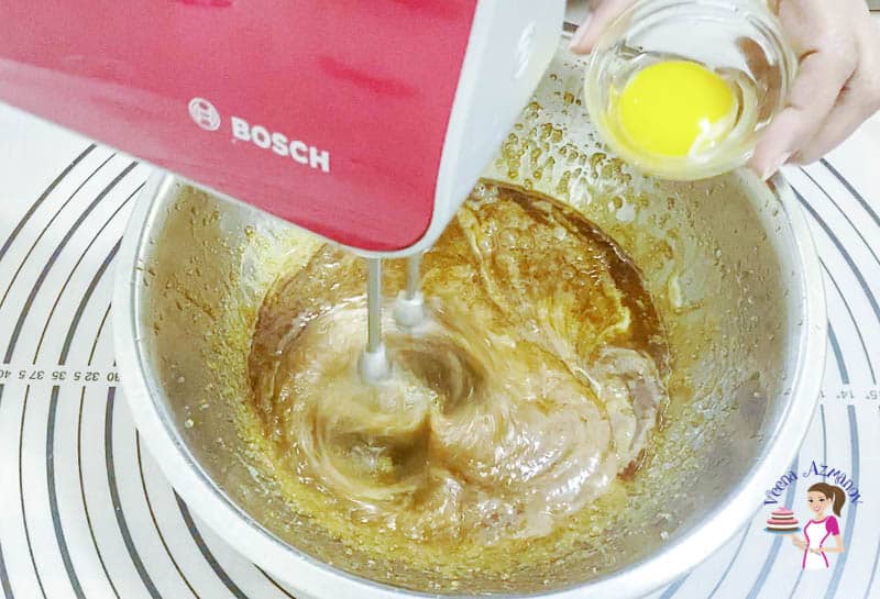 Add the egg yolk to the cookie dough