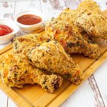 Crispy chicken on a wooden board.
