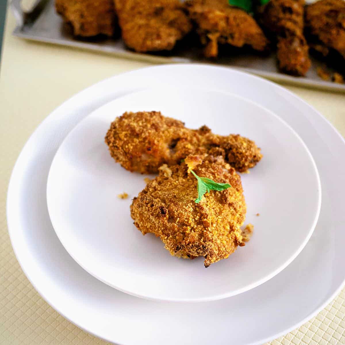 A plate with oven baked crispy chicken.