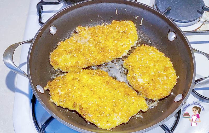 Pan fry the parmesan coated chicken slices