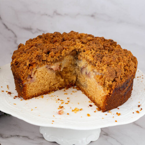 A sliced cake on the cake stand.