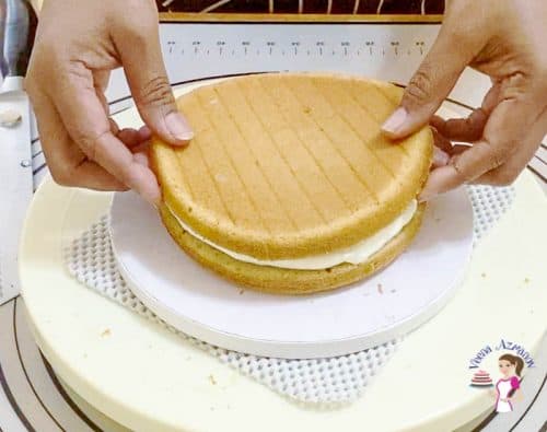 Stack the cake layers with filling