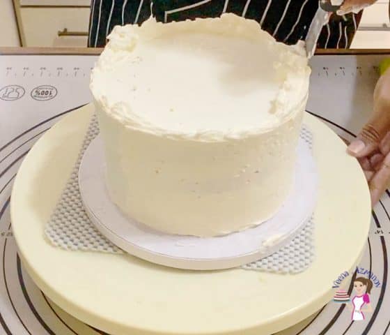 Smooth the cake with bench scraper