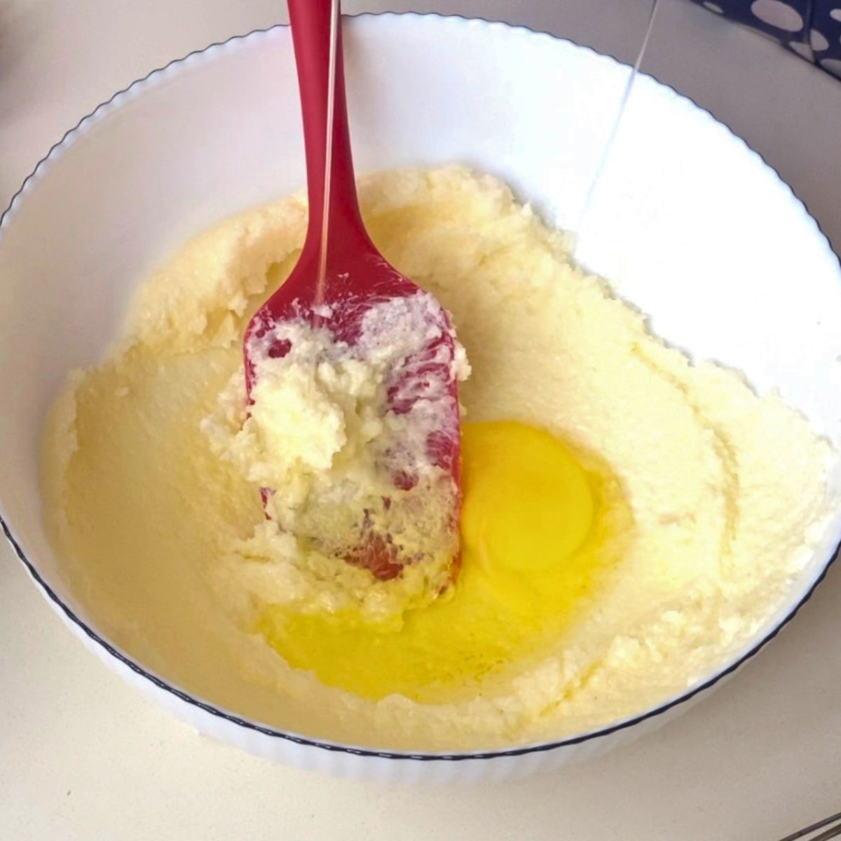 Cream the butter and sugar with egg.