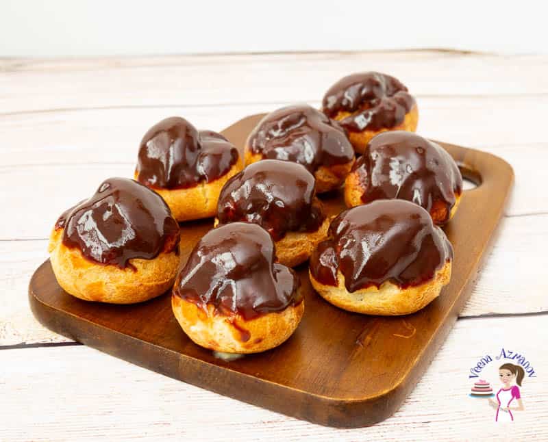 profiteroles on a wooden board.