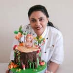 Veena Azmanov with a cake.
