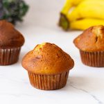 Baked bakery domed banana muffins on the table.