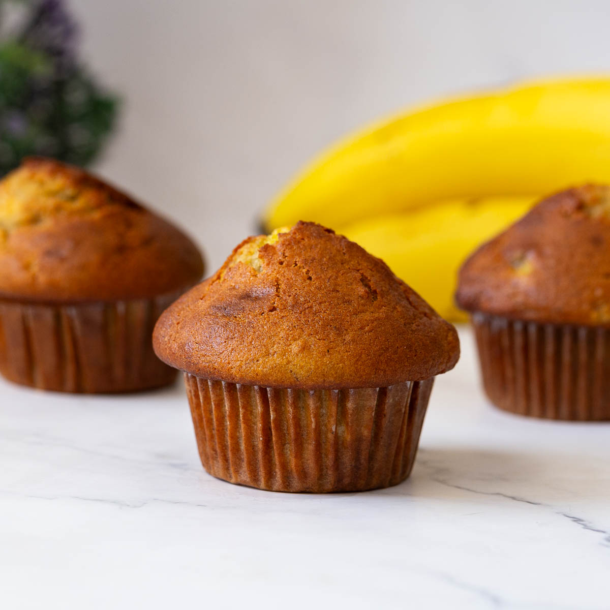 A few baked banana muffins on the table.