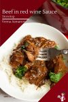 A bowl with beef in red wine gravy and white rice.