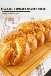 Challah bread on a wooden board.