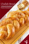 Challah bread on a wooden board.