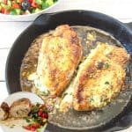 Stuffed chicken breasts in a frying pan.