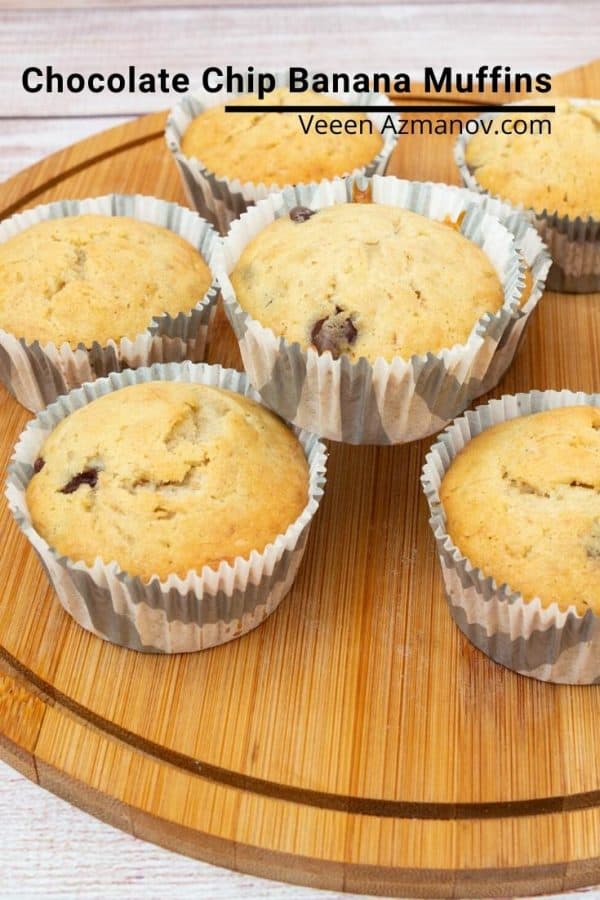 Chocolate chip banana muffins on a wooden board.