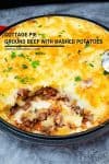 A pan of ground beef with mashed potatoes.