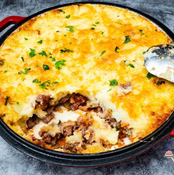 A skillet with ground beef with mashed potatoes.