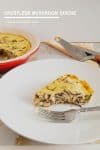 A slice of crustless mushroom quiche in a plate.
