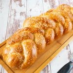 Challah bread on a wooden board.