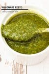 Pesto in a serving dish with a spoon.