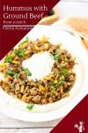 A plate of hummus and ground beef.
