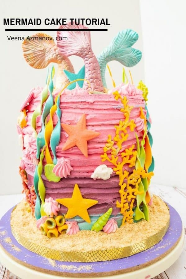 A mermaid birthday cake on a round cake board.