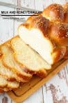A sliced Challah Bread on a wooden board.