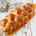 Challah bread on a wooden board.