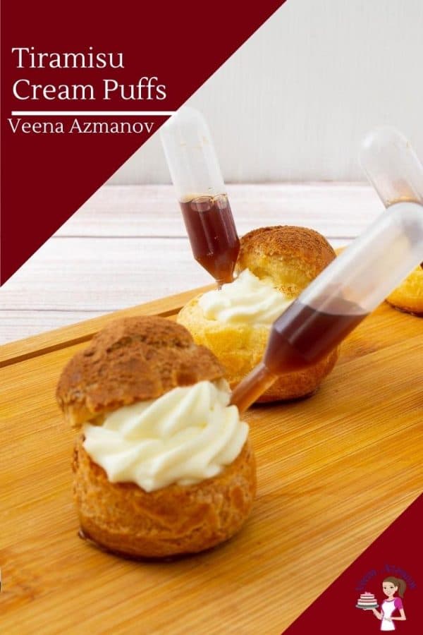 Tiramisu cream puffs on a wooden tray.