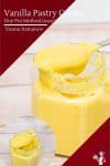 Vanilla pastry cream in a jar and a spoon.